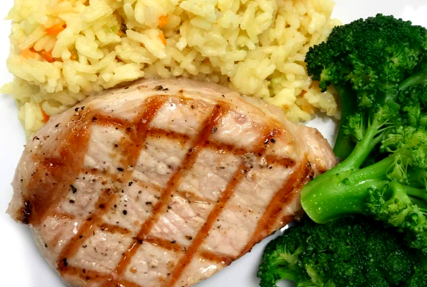 American Barbecue Grilled Pork Chop With Rice Pilaf & Broccoli - Villari Foods